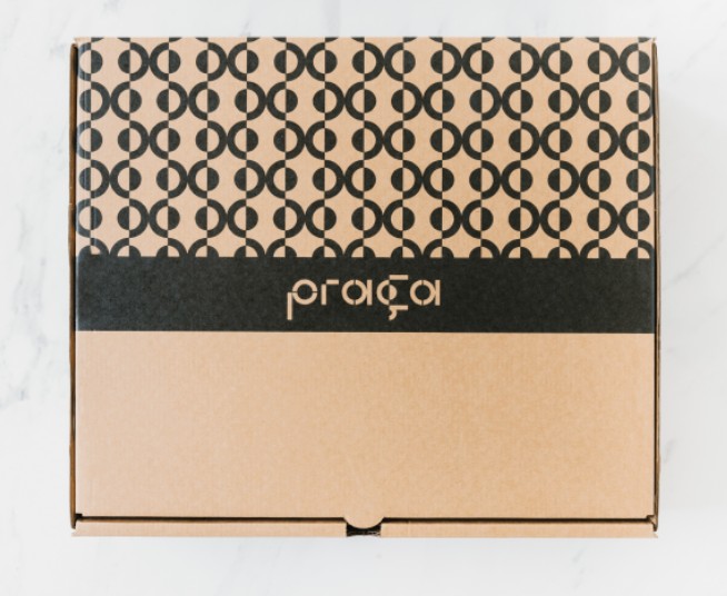 Praça branded box showing the repeating identity pattern.